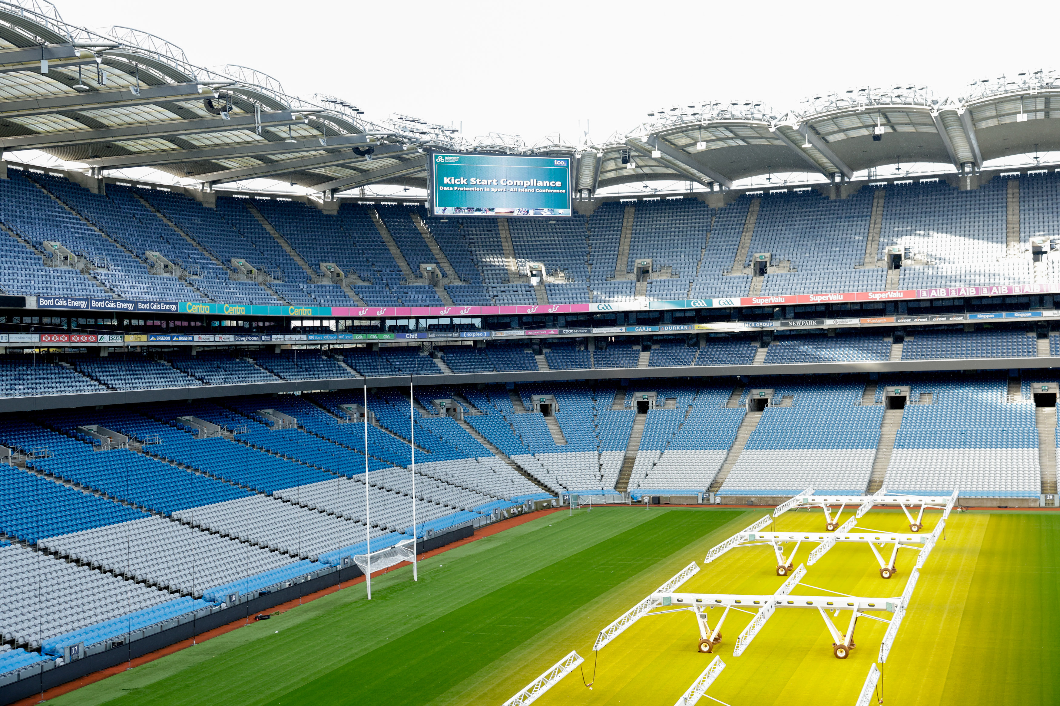 The Croke Park pitch and stand, with a large screen in the background which reads, "Kickstart Compliance".